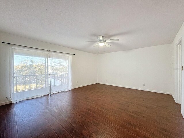 9201 Tudor Dr Unit C212, Tampa, FL 33615 - unfurnished room with ceiling fan, dark wood-style flooring, and baseboards