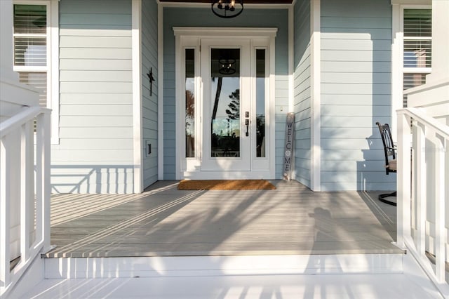 216 High St, Tarpon Springs, FL 34689 - view of exterior entry featuring a porch