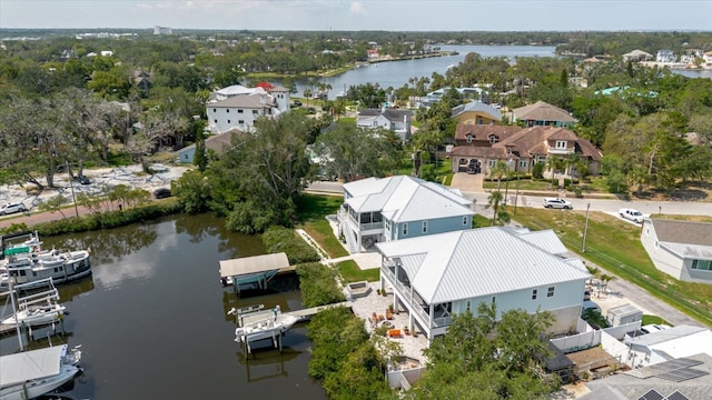 216 High St, Tarpon Springs, FL 34689 - aerial perspective of suburban area featuring a large body of water and a tree filled landscape