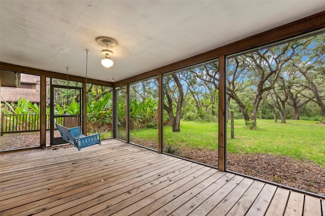 56 Bay Woods Dr, Safety Harbor, FL 34695 - unfurnished sunroom featuring view of wooded area
