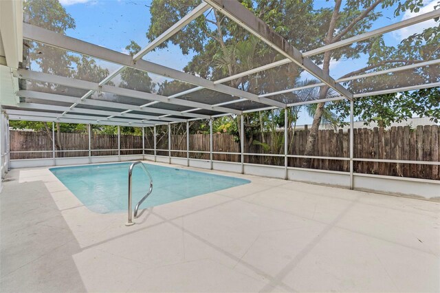 9241 Cochise Ln, Port Richey, FL 34668 - view of pool with a fenced backyard, a patio area, and glass enclosure