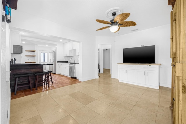 3310 W Ballast Point Blvd, Tampa, FL 33611 - living area with ceiling fan, baseboards, recessed lighting, and light tile patterned floors