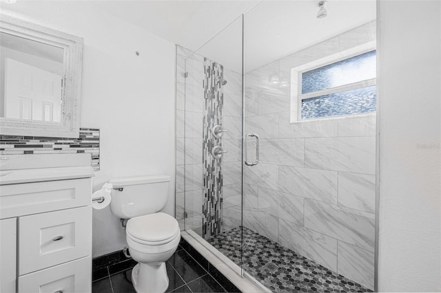 3310 W Ballast Point Blvd, Tampa, FL 33611 - bathroom with toilet, a stall shower, vanity, and baseboards