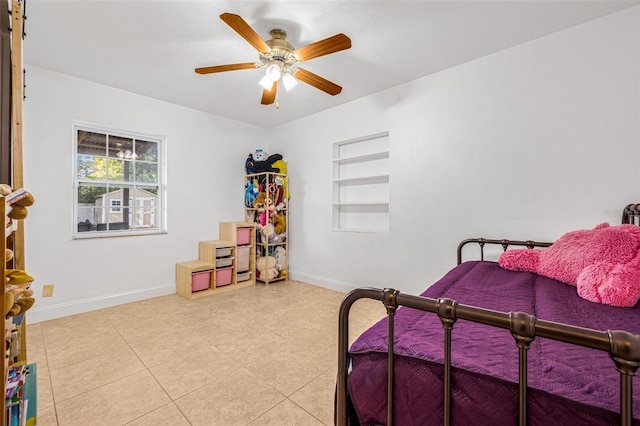3310 W Ballast Point Blvd, Tampa, FL 33611 - bedroom featuring baseboards and ceiling fan
