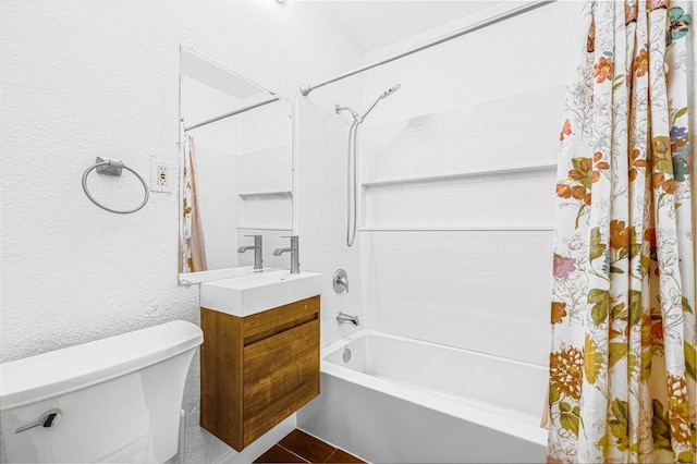 3310 W Ballast Point Blvd, Tampa, FL 33611 - bathroom with shower / bath combo, toilet, a textured wall, and vanity