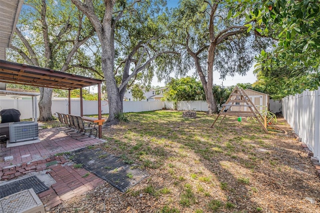 3310 W Ballast Point Blvd, Tampa, FL 33611 - fenced backyard featuring central air condition unit and a patio