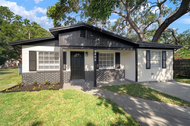 5405 S Sellas St, Tampa, FL 33611 - bungalow-style house with brick siding and covered porch