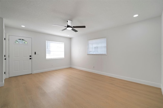 5405 S Sellas St, Tampa, FL 33611 - foyer entrance featuring light wood-type flooring, ceiling fan, healthy amount of natural light, baseboards, and recessed lighting