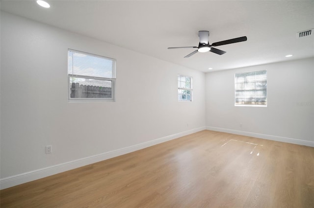 5405 S Sellas St, Tampa, FL 33611 - unfurnished room with light wood-style floors, ceiling fan, baseboards, and recessed lighting