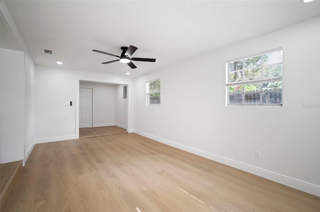 5405 S Sellas St, Tampa, FL 33611 - unfurnished bedroom with multiple windows, recessed lighting, light wood-style floors, and baseboards