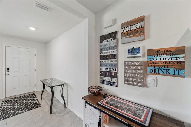 3739 Capri Coast Dr, Plant City, FL 33565 - foyer entrance with light tile patterned floors and baseboards