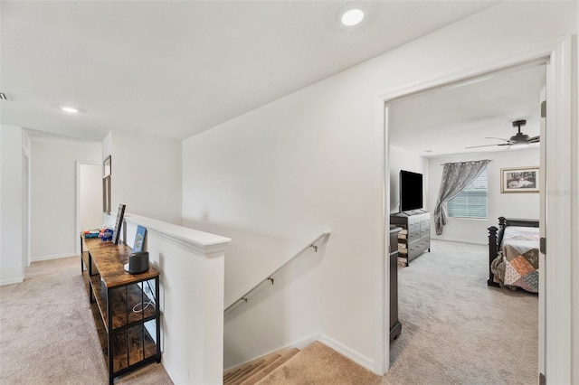 3739 Capri Coast Dr, Plant City, FL 33565 - hall featuring an upstairs landing, light colored carpet, baseboards, and recessed lighting