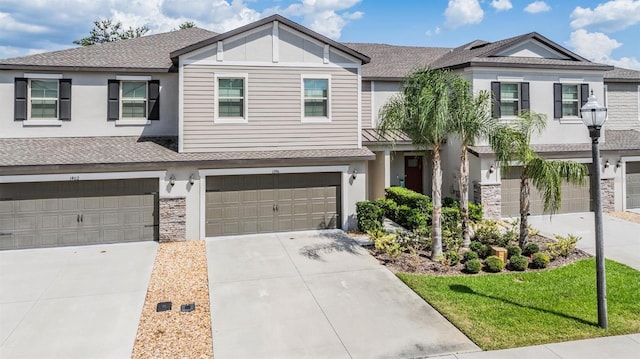 1396 White Fox Run, Lutz, FL 33549 - multi unit property featuring a shingled roof, an attached garage, concrete driveway, stucco siding, and stone siding