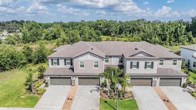 1396 White Fox Run, Lutz, FL 33549 - view of property with a garage, driveway, a front yard, and a shingled roof