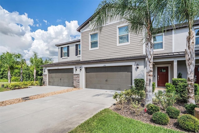 1396 White Fox Run, Lutz, FL 33549 - view of front of house featuring an attached garage, concrete driveway, stone siding, and stucco siding