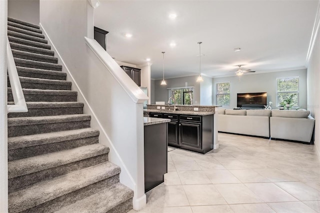 1396 White Fox Run, Lutz, FL 33549 - kitchen with ornamental molding, a sink, light tile patterned floors, plenty of natural light, and open floor plan