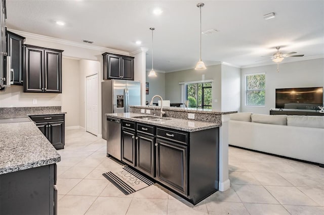 1396 White Fox Run, Lutz, FL 33549 - kitchen featuring appliances with stainless steel finishes, a sink, open floor plan, a ceiling fan, and light tile patterned flooring