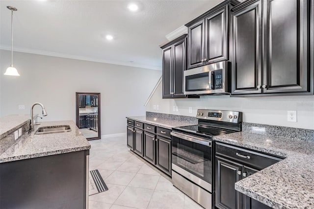 1396 White Fox Run, Lutz, FL 33549 - kitchen with appliances with stainless steel finishes, a sink, crown molding, dark cabinets, and hanging light fixtures