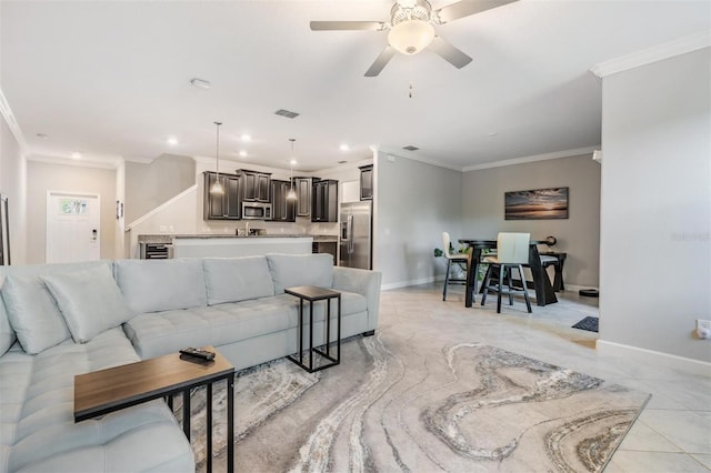 1396 White Fox Run, Lutz, FL 33549 - living area with crown molding, ceiling fan, baseboards, recessed lighting, and light tile patterned floors