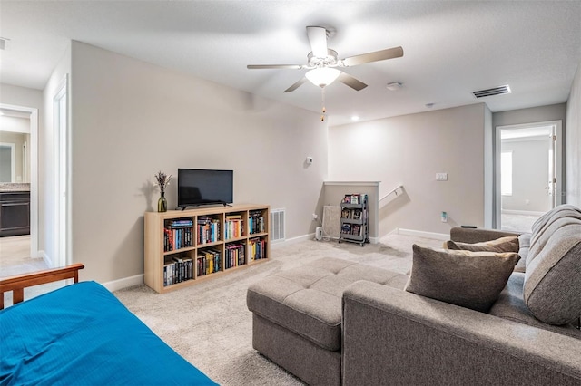 1396 White Fox Run, Lutz, FL 33549 - carpeted living room with ceiling fan and baseboards