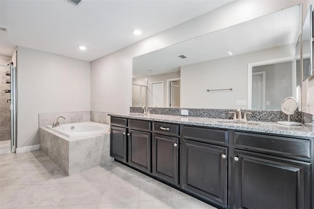1396 White Fox Run, Lutz, FL 33549 - bathroom with double vanity, a bath, a shower stall, tile patterned floors, and recessed lighting