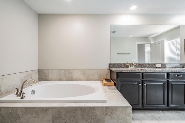 1396 White Fox Run, Lutz, FL 33549 - bathroom with double vanity and a bath