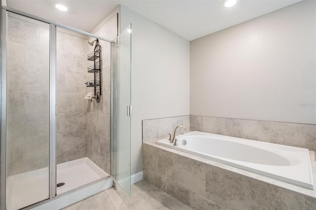 1396 White Fox Run, Lutz, FL 33549 - full bathroom featuring a garden tub, a shower stall, tile patterned flooring, recessed lighting, and baseboards