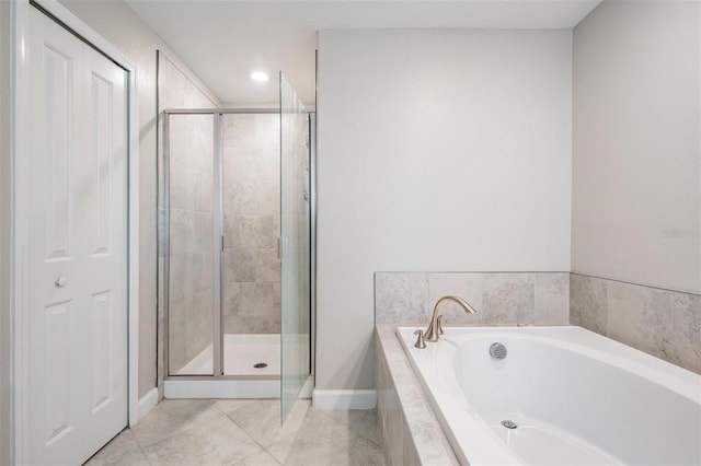 1396 White Fox Run, Lutz, FL 33549 - bathroom with a bath, a stall shower, baseboards, tile patterned flooring, and recessed lighting