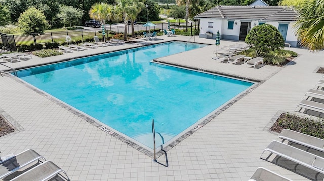 1396 White Fox Run, Lutz, FL 33549 - community pool featuring a patio and view of scattered trees