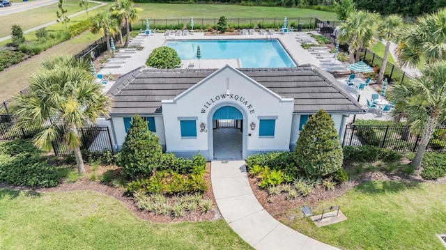 1396 White Fox Run, Lutz, FL 33549 - view of front of property featuring a tile roof, a community pool, and stucco siding