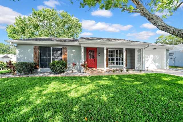 12401 Yorktown Ln, Bayonet Point, FL 34667 - ranch-style home featuring an attached garage, a front lawn, concrete driveway, and stucco siding
