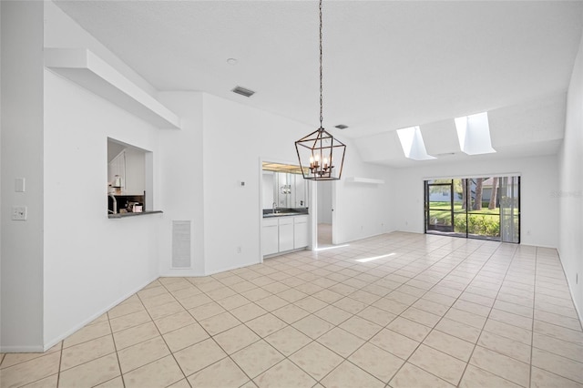 3447 Killdeer Pl, Palm Harbor, FL 34685 - unfurnished living room with a skylight, light tile patterned floors, a sink, a chandelier, and lofted ceiling