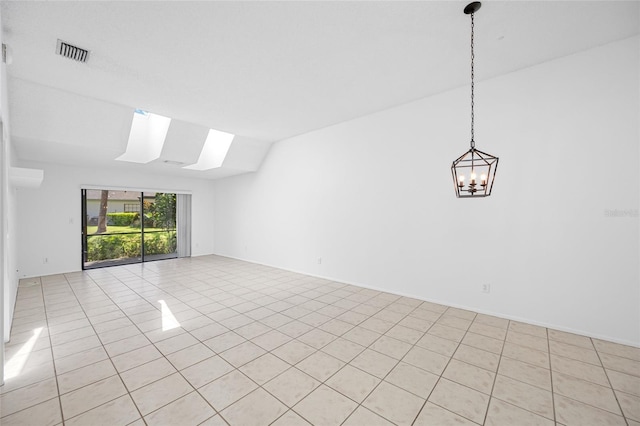 3447 Killdeer Pl, Palm Harbor, FL 34685 - empty room with a skylight, light tile patterned floors, a chandelier, and lofted ceiling