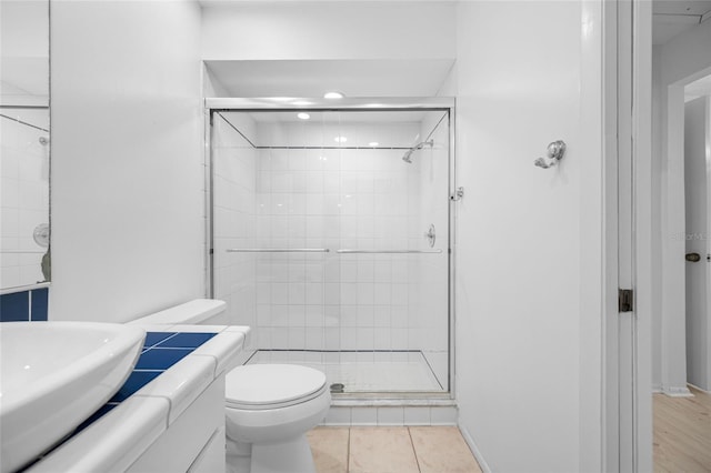 3447 Killdeer Pl, Palm Harbor, FL 34685 - bathroom with a stall shower, toilet, vanity, and tile patterned flooring