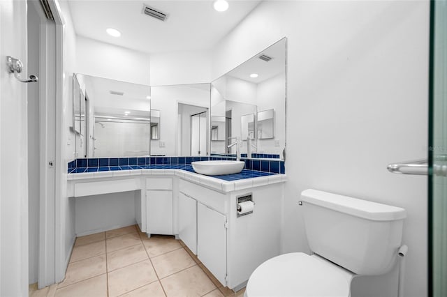 3447 Killdeer Pl, Palm Harbor, FL 34685 - full bathroom featuring vanity, a stall shower, toilet, tile patterned flooring, and recessed lighting