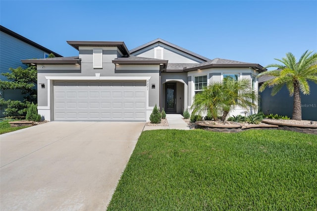 9271 Rally Spring Loop, Wesley Chapel, FL 33545 - view of front of home featuring concrete driveway, stucco siding, a garage, and a front yard