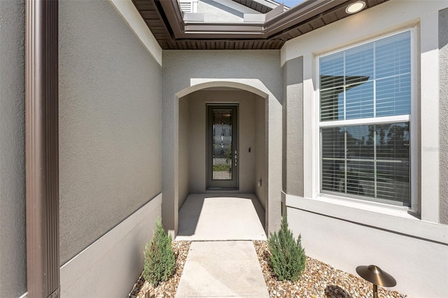 9271 Rally Spring Loop, Wesley Chapel, FL 33545 - view of exterior entry with stucco siding