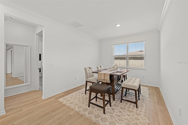 9271 Rally Spring Loop, Wesley Chapel, FL 33545 - dining area featuring crown molding, light wood-type flooring, baseboards, and recessed lighting