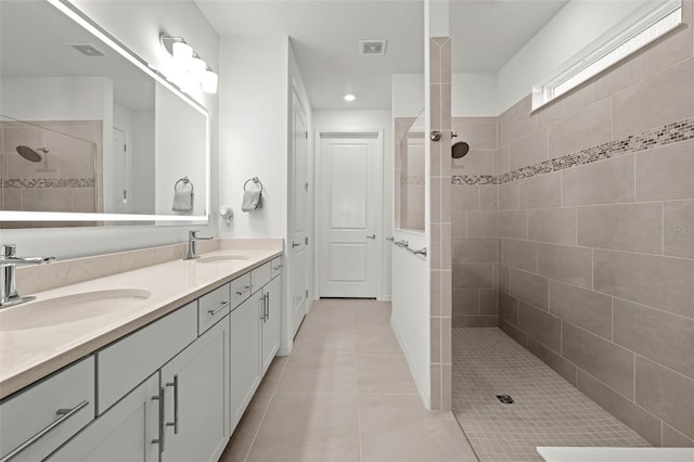9271 Rally Spring Loop, Wesley Chapel, FL 33545 - full bathroom featuring double vanity, walk in shower, tile patterned flooring, and recessed lighting