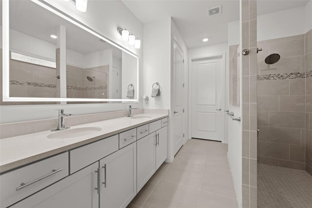 9271 Rally Spring Loop, Wesley Chapel, FL 33545 - bathroom featuring double vanity, tile patterned floors, walk in shower, and recessed lighting