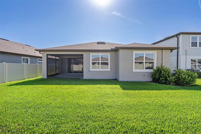 9271 Rally Spring Loop, Wesley Chapel, FL 33545 - rear view of house featuring a sunroom, stucco siding, and a shingled roof