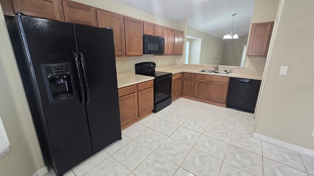 1416 Silverthorn Dr, Orlando, FL 32825 - kitchen with black appliances, a sink, light countertops, light tile patterned floors, and brown cabinetry