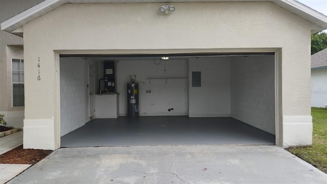 1416 Silverthorn Dr, Orlando, FL 32825 - garage with water heater, electric panel, and driveway