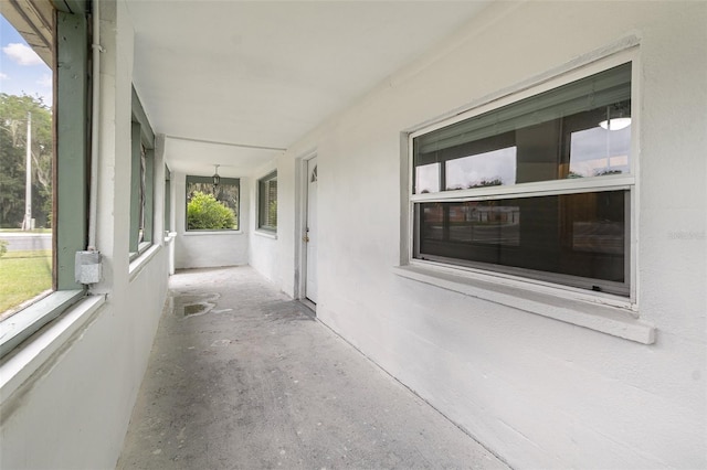130 E Pendleton Ave, Eustis, FL 32726 - unfurnished sunroom featuring a chandelier and unfinished concrete floors