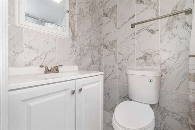 130 E Pendleton Ave, Eustis, FL 32726 - bathroom featuring tile walls, vanity, and toilet