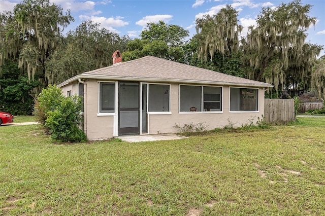 130 E Pendleton Ave, Eustis, FL 32726 - bungalow-style house with a chimney and a shingled roof