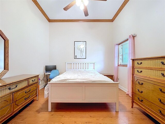 13341 Hexam Rd, Weeki Wachee, FL 34613 - bedroom with crown molding, light wood-style floors, and a ceiling fan