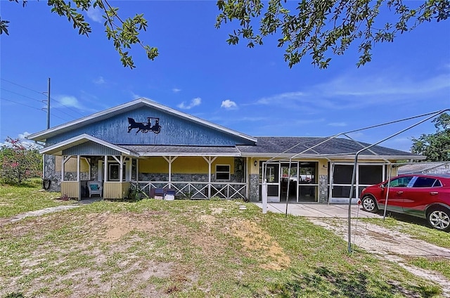13341 Hexam Rd, Weeki Wachee, FL 34613 - view of front facade with covered porch and driveway