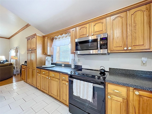13341 Hexam Rd, Weeki Wachee, FL 34613 - kitchen featuring stainless steel microwave, black electric range, lofted ceiling, dark countertops, and light tile patterned floors