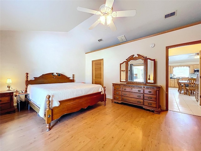 13341 Hexam Rd, Weeki Wachee, FL 34613 - bedroom with light wood-style flooring, a ceiling fan, a closet, and crown molding